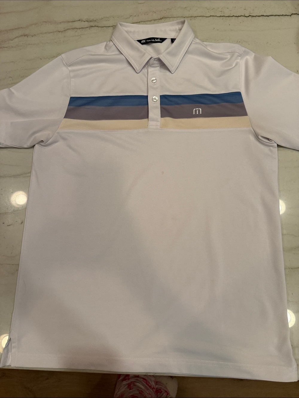 Travis Mathew White Polo with Blue, Gray and Tan Chest Stripes
